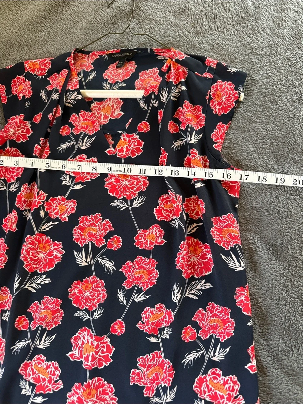 Two Banana Republic sleeveless blouses.